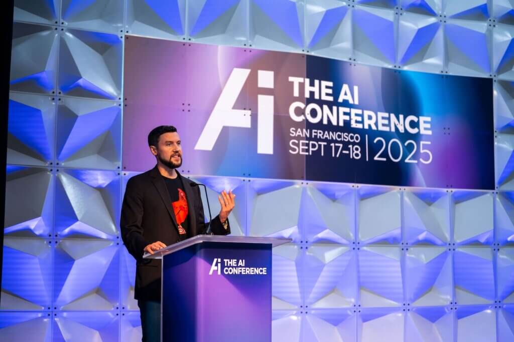 Speaker presenting to a large audience at The AI Conference 2026